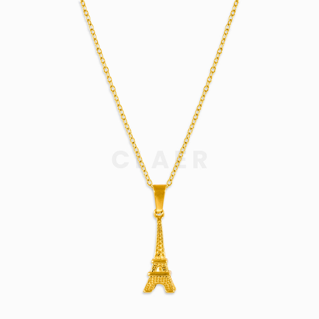 Goldener Eiffelturm-Anhänger auf einer Gliederkette.