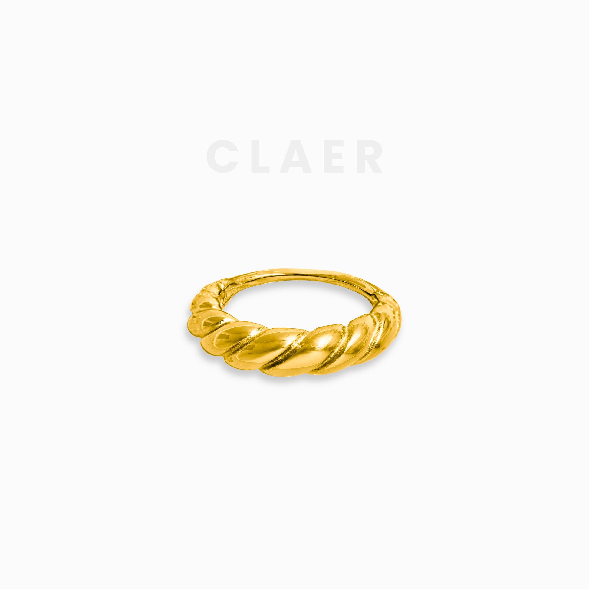Feiner, goldener Ring mit dezentem Swirl-Muster.
