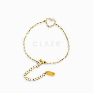 Feines, goldenes Armband mit einem diamantbesetzten Herz in der Mitte.