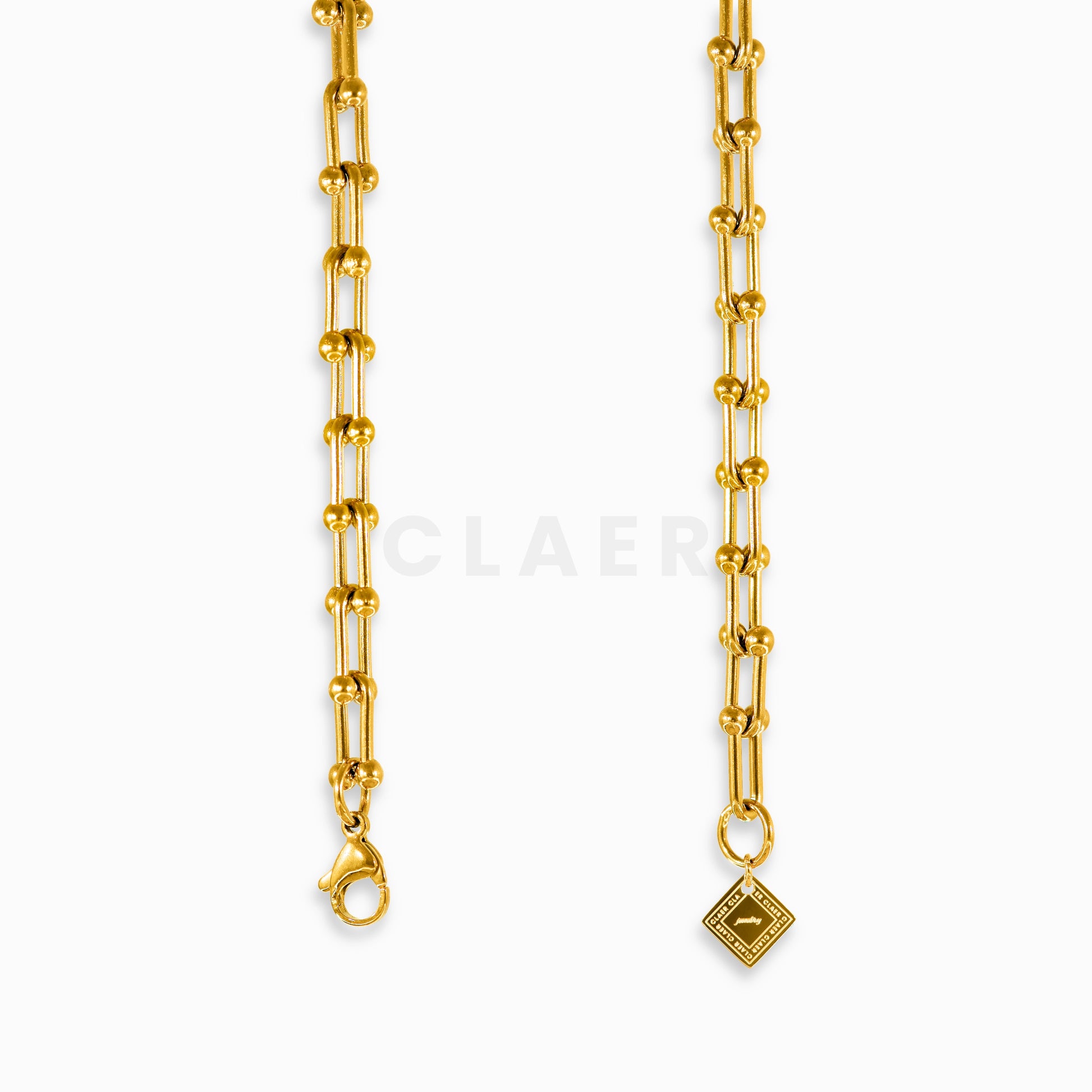 Goldene Horseshoe-Kette im Hufeisen-Design, Verschluss und Logo-Tag von CLAER.