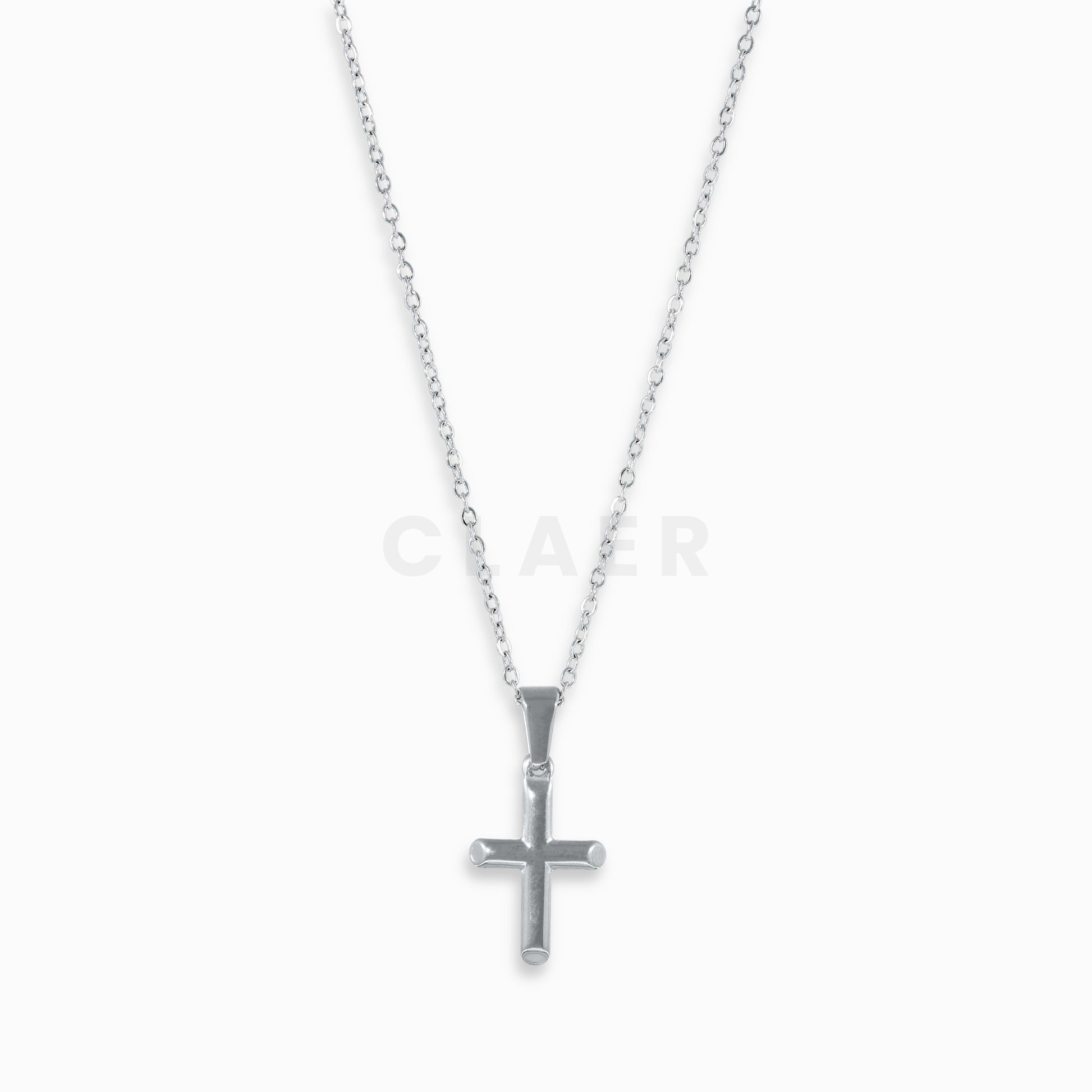 Kleiner Kreuzanhänger aus Silber auf einer Gliederkette.